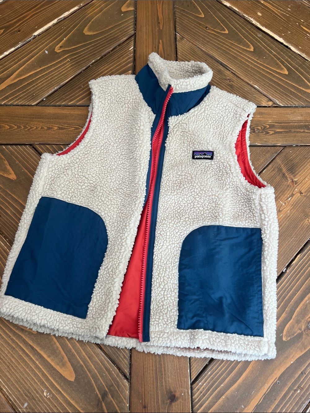 Patagonia Cream Sherpa Vest with Navy Pockets and Red Lining